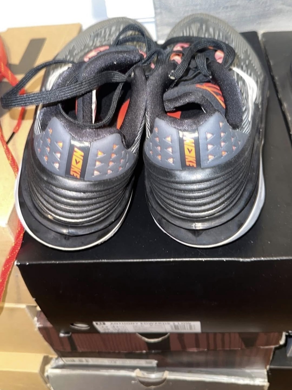 Nike Men's Black Athletic Sneakers with Orange Accents